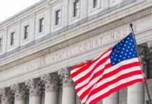 Trump Axes Election Watchdogs—Chaos Looms United States courthouse with American flag waving.