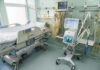 Hospital bed with medical equipment and monitors.