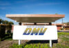 Showdown: Trump Versus California’s Car Rules California DMV building with sign and greenery