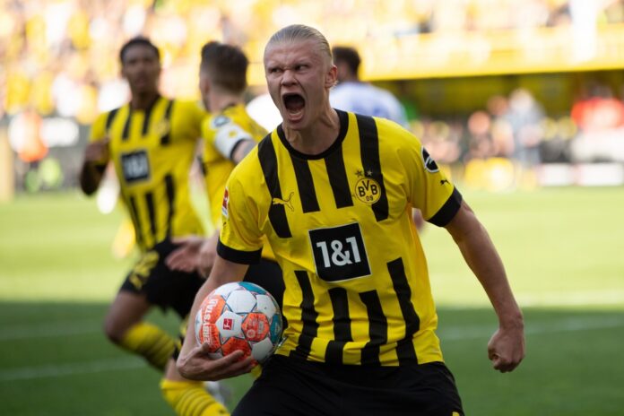 Dortmund,,Germany,-,May,14,2022:,Erling,Haaland.,The,Match Soccer player in yellow and black jersey celebrating with ball