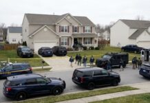Iran Kill List Bombshell at NATO FBI agents conducting an operation in a suburban neighborhood