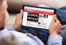 Person reading news website on tablet