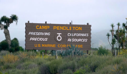 Camp Pendleton entrance sign in a desert landscape